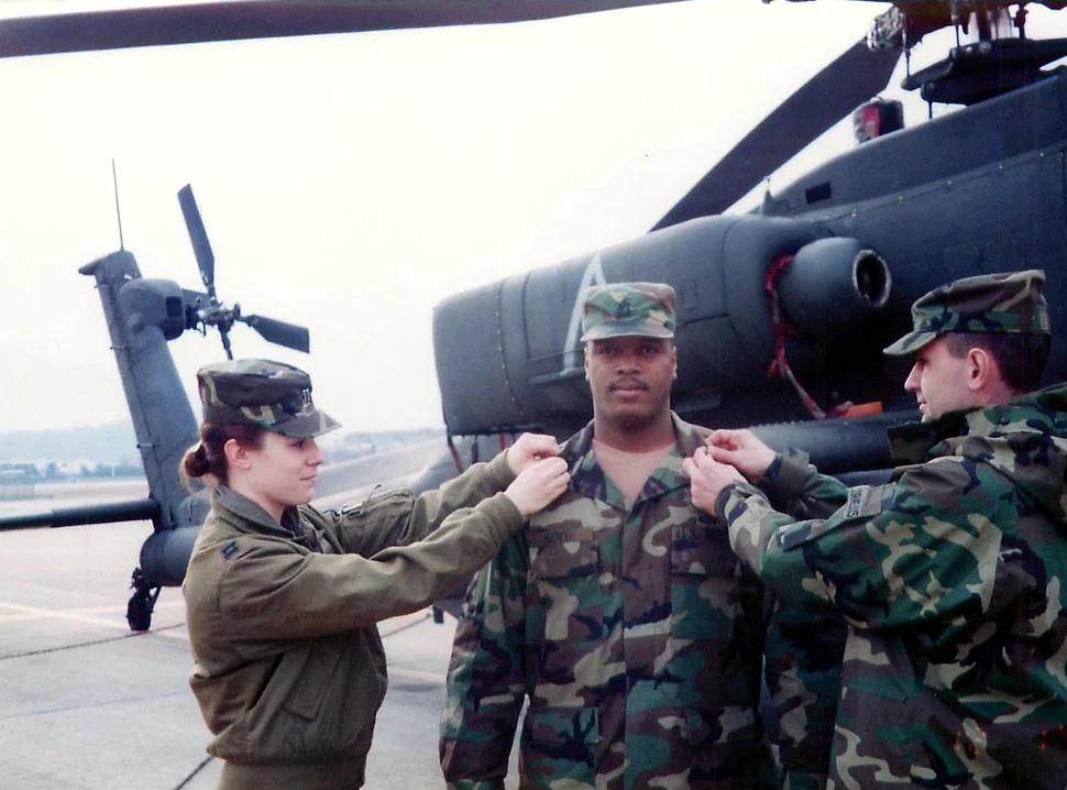 Shannon Huffman Polson: a promotion ceremony in front of an Apache helicopter